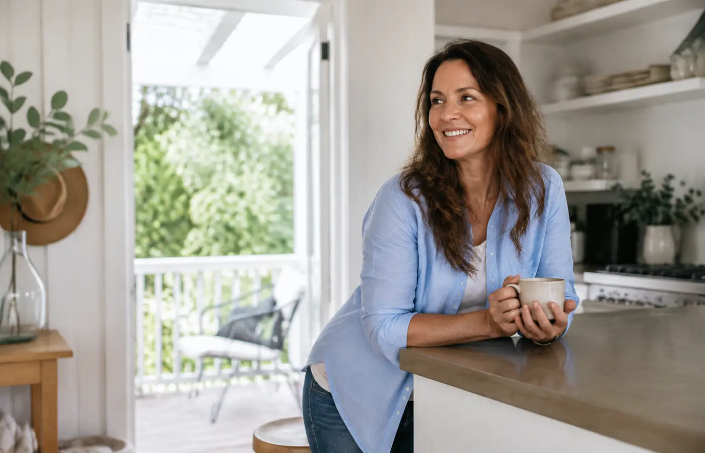 Woman smiling during a calm daily routine at home